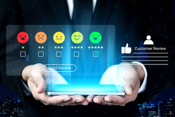 A businessman showcases a tablet with a customer review interface featuring emoticons and rating...