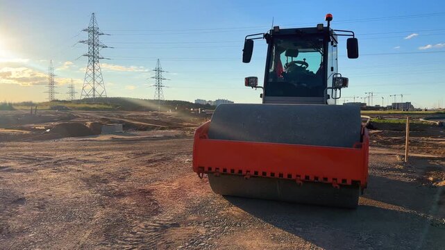 Soil Compactor on compact the road surface during road construction. Road compaction equipment at construction site. Vibration single-cylinder road roller, Vibratory Soil Compactor. Single Drum Roller
