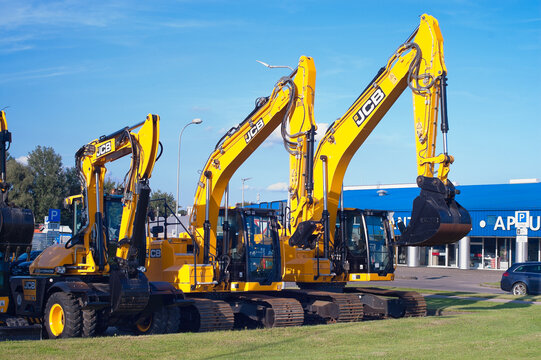 Riga, Latvia - July 30, 2026: New JCB excavators on the street near the auto center