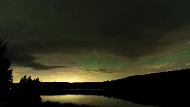 Timelapse of stars moving through the sky in the Utah wilderness viewing airglow over Lyman Lake.