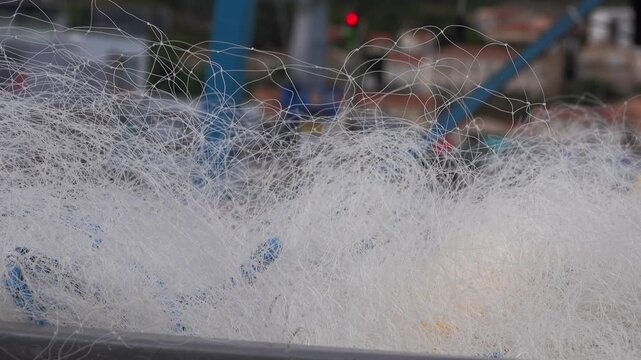 Fishing lines and nets line at maritime port