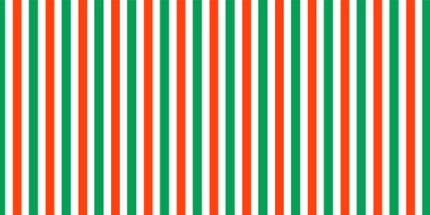 Fototapeta premium Christmas seamless pattern. Red and green diagonal stripes background. Candy cane repeating decoration wallpaper. Winter holiday lines backdrop.