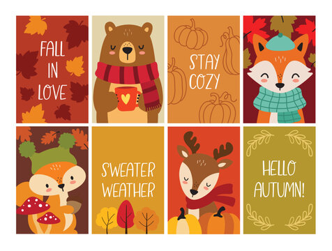 A cute vector illustration of woodland animals including a bear, fox, deer, and squirrel, dressed in cozy autumn scarves and hats, with pumpkins and colorful fall tree and leaves.