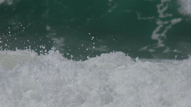 close up of white water moving in slow motion in the ocean
