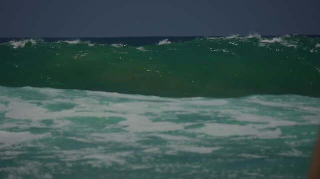Large waves breaking in the ocean at huntington beach CA