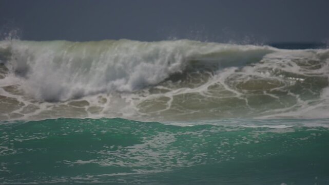 medium sized waves breaking in the ocean