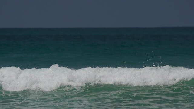 small surf breaking in the ocean