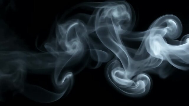 Abstract white smoke swirls on black
