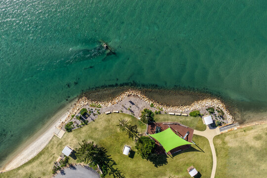 Aerial view of Foreshore Park at Settlement Point in Port Macquarie, featuring the waterfront reserve, surrounding greenery and scenic waters of the Hastings River 