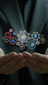 Businessman open hands vertical shot supporting glowing gear mechanism displaying Core Values central text and icons. Corporate business ethics, organizational culture, and integrity concept.
