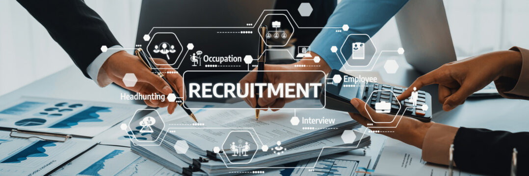 Professionals are collaborating in an office setting, focusing on recruitment strategies using persuasive data and graphs, showcasing teamwork and engagement with hiring practices. Amity