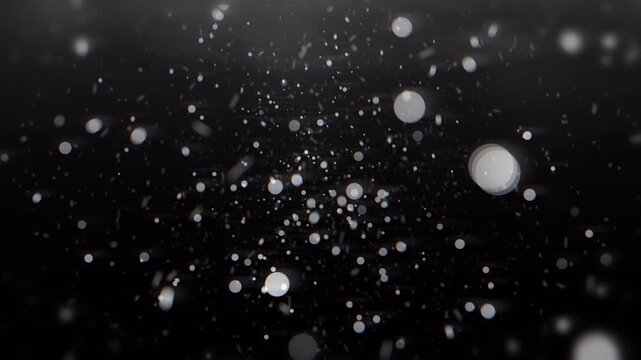 Glitter silver bokeh background with glowing white circular particles and lights. Suitable for festive invitations, holiday designs, or elegant backgrounds.