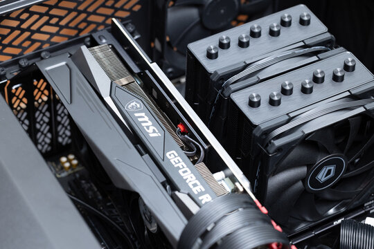 Open case of a high-end gaming PC or graphics workstation, showing an MSI GeForce RTX graphics card and a dual-tower CPU cooler. Pavlodar, Kazakhstan - June 08, 2024
