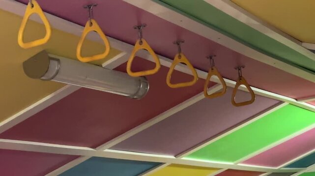 Children&rsquo;s Monkey Bar Climbing Structure Inside a Home Playroom With Indoor Recreation Equipment and Bright Family Living Space