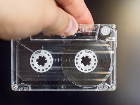 Vintage Audio Cassette Tape Being Held Up