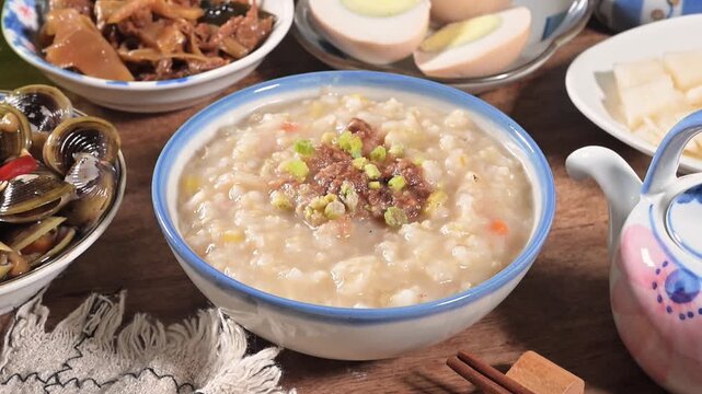 Brown rice porridge served with side dish on the table. 