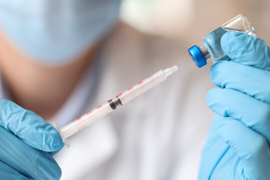 Vaccine development and medical research, doctor preparing injection with syringe and vial, healthcare and pharmaceutical industry