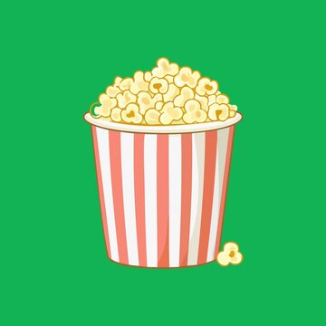 Red and white striped bucket full of popcorn isolated on white background