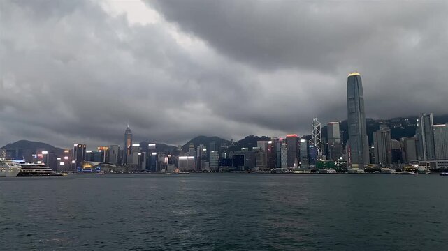 Hong Kong skyline, Victoria Harbour, cloudy sky, stormy weather, skyscrapers, Victoria Harbour timelapse/footage