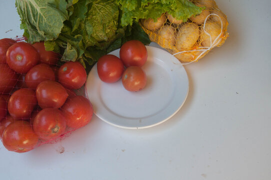 close-up of tomato  , potato and lettuce.    Vegetables on a white background, 