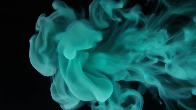 Luminous turquoise vapor rolls slowly across deep black space in dense translucent waves and soft curls, forming a mesmerizing mandala-like pattern with subtle glowing edges and drifting particles.