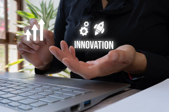 Professional gesturing 'innovation' symbols over computer