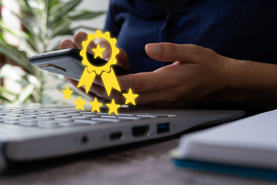 Hands interact with device, glowing stars symbolize achievement