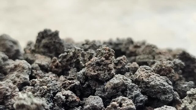 Black volcanic lava stone gravel, natural porous basalt rock texture for aquascape and gardening