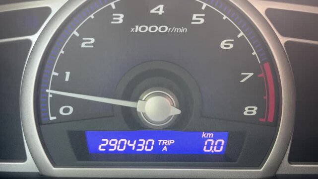 Car digital trip odometer resetting to zero close up