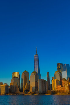 Stunning skyline of New York City bathed in golden sunlight at dusk