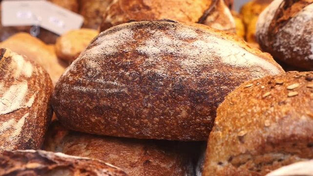 Bakers display different bread types at local market