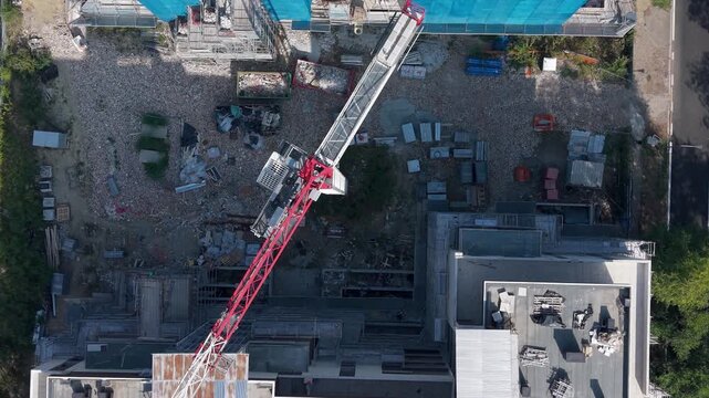 Tower Crane Over New Apartment Buildings Under Construction Aerial View. San Donato Milanese, Milan, Italy