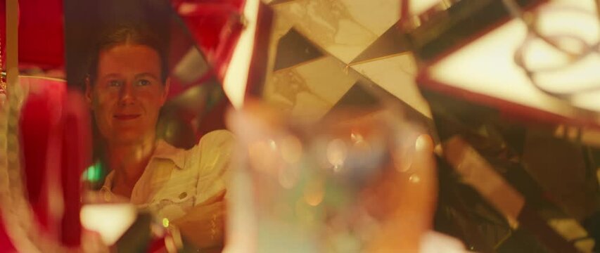 Woman dreamy reflection in luxury display reveals her desire and curiosity to own what is inside