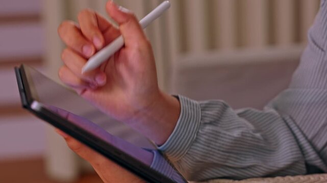 Digital tablet stylus hand drawing screen close artist creative device touchscreen technology for sketching design work indoor soft light blurred home background