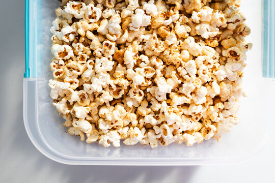 popcorn in clear container for organized food storage and healthy snacking