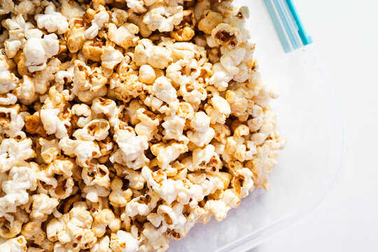 popcorn in clear container for organized food storage and healthy snacking