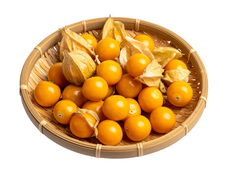 golden berry or Cape Gooseberries on a woven bamboo plate isolated on transparent png