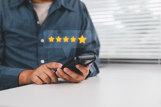 Customer review good rating feedback concept, A person using a smartphone to leave a 5-star review, with emphasizing online feedback. testimonial and testimony, user comment and feedback for review.