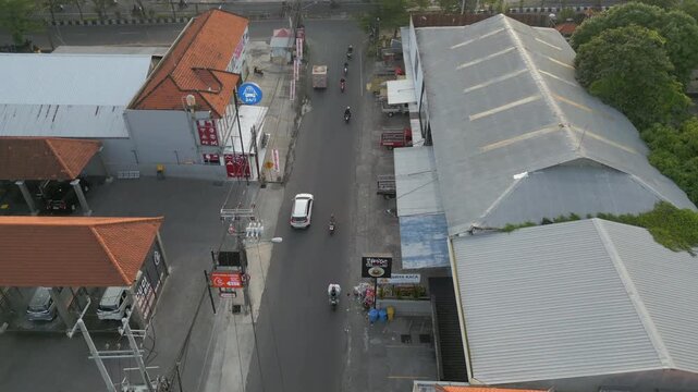 Quiet Neighborhood Street In Legian Scooters And Vehicles Driving Bali Indonesia Drone Track Forward 4K 60FPS