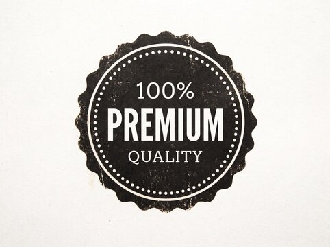 Vintage Style Black Premium Quality Seal with Scalloped Edge and Distressed Texture Isolated on White Background