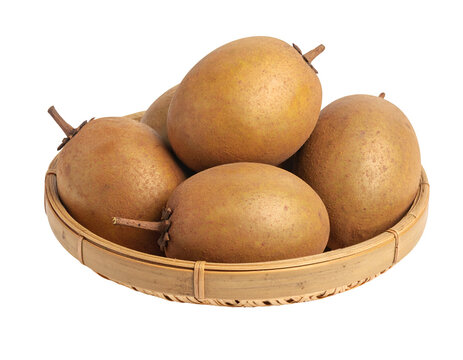 Sapodillas on a woven bamboo plate isolated on transparent png