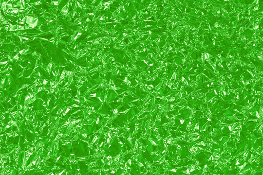 Green lime foil shiny texture, abstract wrapping paper for background and design art work.