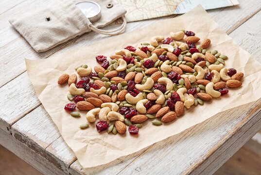 Abundant Healthy Trail Mix with Nuts and Cranberries on Paper