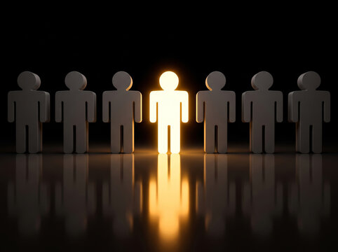 Illuminated figurines standing on a dark surface with reflections in a black background