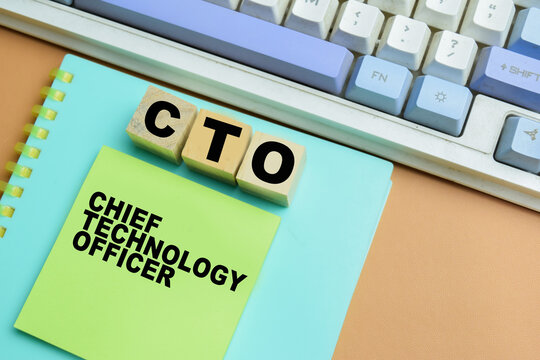 Concept of CTO - Chief Technology Officer write on sticky notes isolated on table.