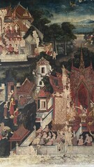 Traditional Thai Buddhist mural painting depicting Buddhist mythology on the temple wall in Bangkok, Thailand. © lawplow