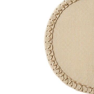 Detailed close-up of beige woven placemat with decorative raffia stitching isolated on white background