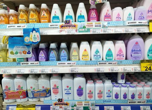 KUALA TERENGGANU, MALAYSIA- AUGUST 20. 2026: Organized rows of Johnson's Baby care products including bath wash, baby oil, and cornstarch powder neatly arranged on hypermarket shelves.