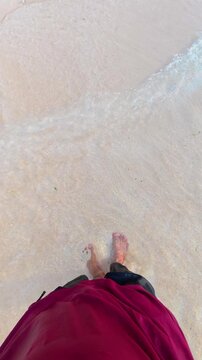 Person Standing on Tropical Beach Sand