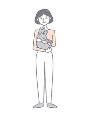 Fototapeta premium 猫を抱っこする笑顔の若い女性